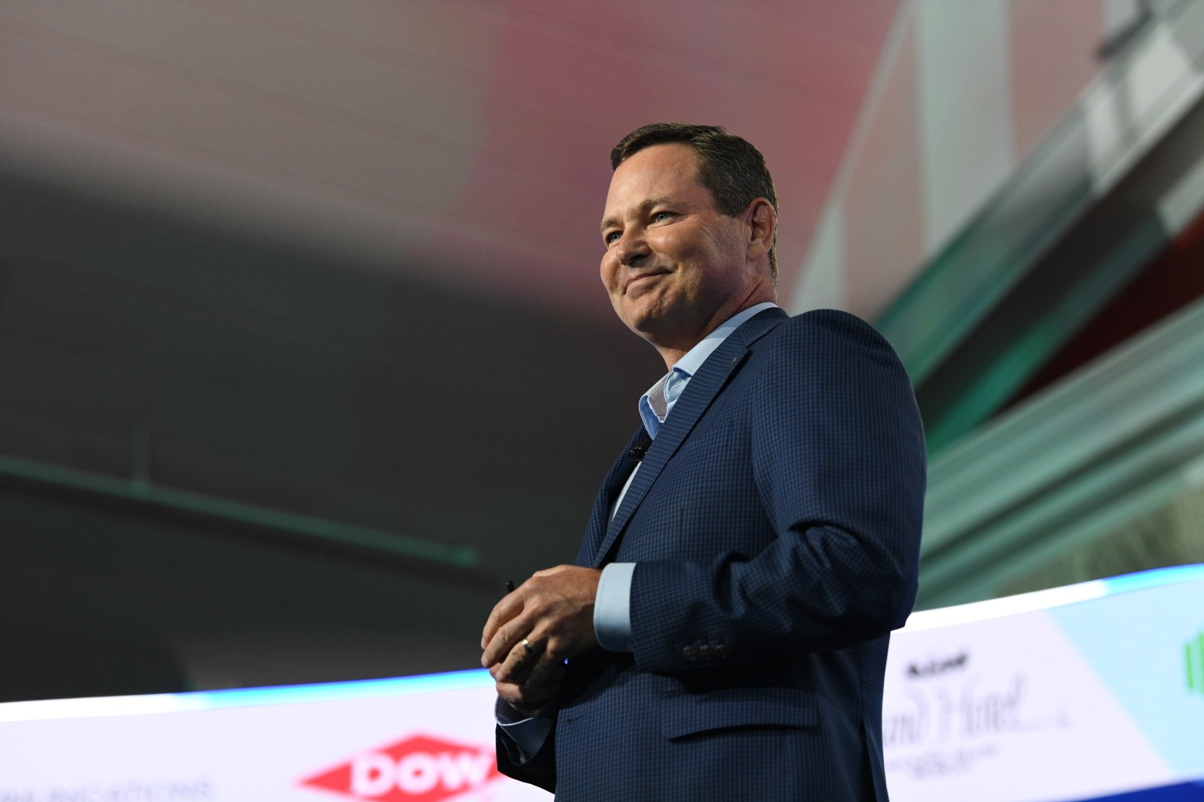 Matt Elliott smiling on stage at the Mackinac Policy Conference